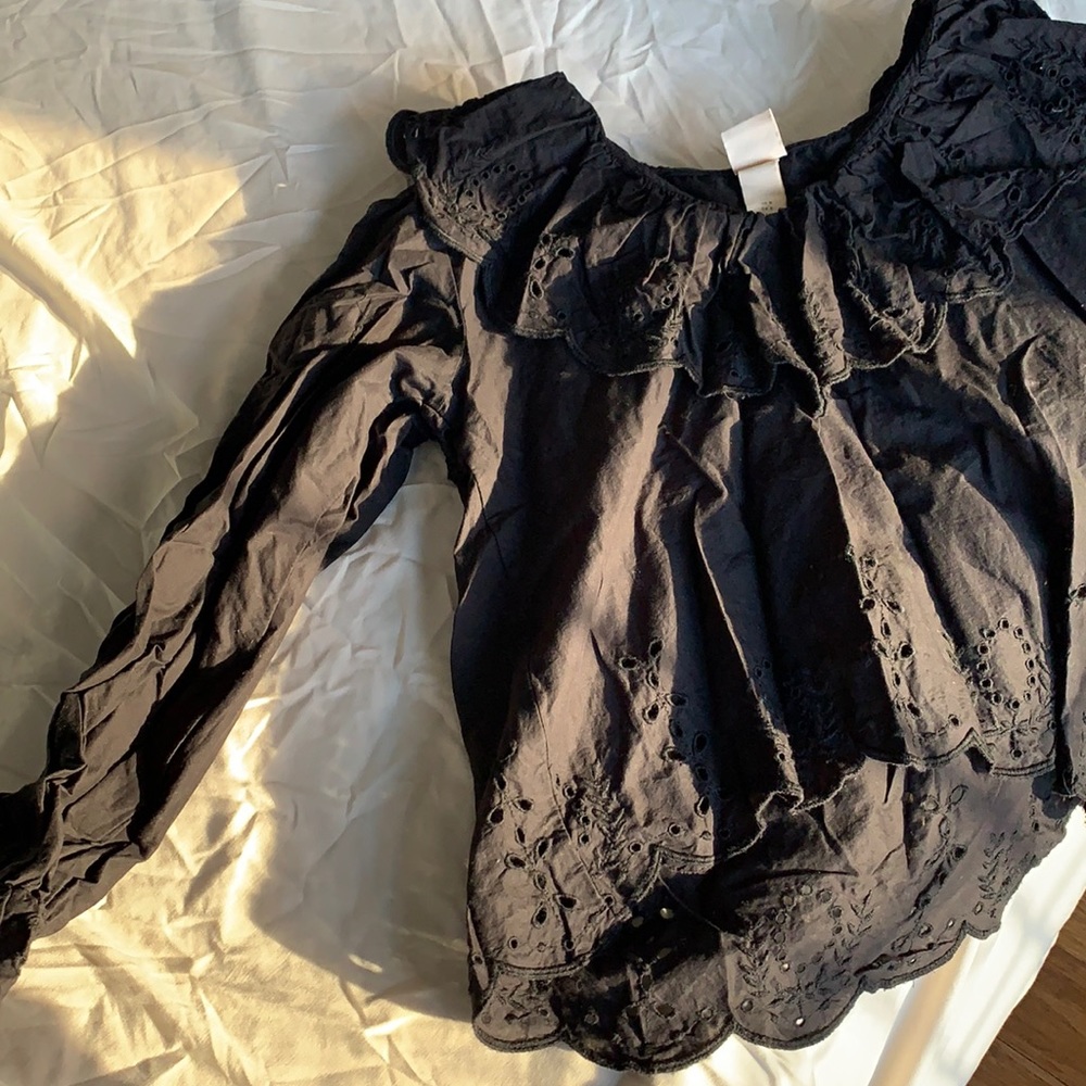 Ruffled black blouse